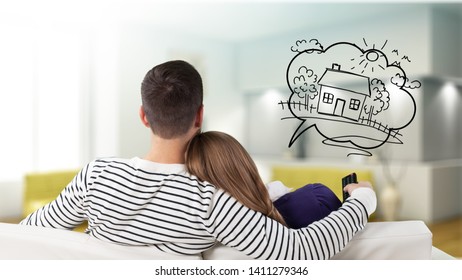Young Couple Sitting On Sofa