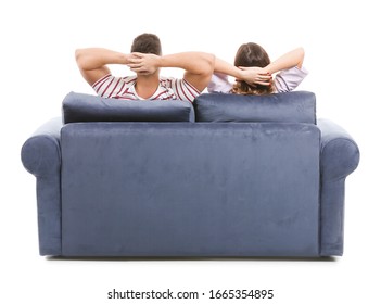 Young couple sitting on sofa against white background, back view