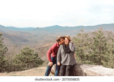 A Young Couple Sitting Together In 
Gatlinburg, Tennessee