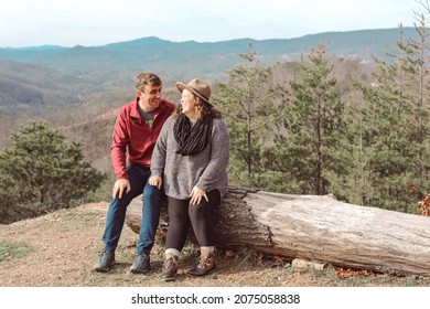 A Young Couple Sitting Together In 
Gatlinburg, Tennessee