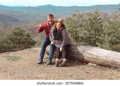 A Young Couple Sitting Together In 
Gatlinburg, Tennessee