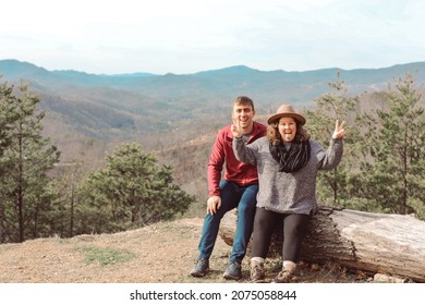 A Young Couple Sitting Together In 
Gatlinburg, Tennessee