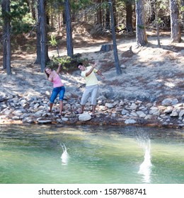 A Young Couple Skimming Stones