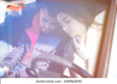 Young Couple Sleeping In Car During Traffic Jam