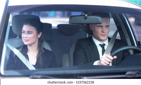 Young Couple Smiling Feeling Modest On First Date, Sitting In Car, Romance