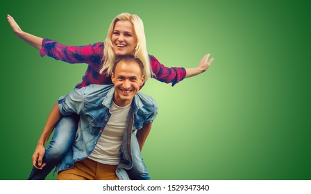 Young couple smiling green background - Powered by Shutterstock