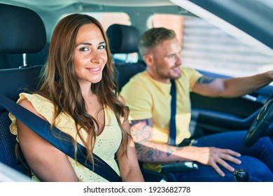 Young Couple Smiling Happy Driving Car,