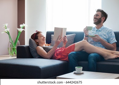 Young Couple Spending Time In The Living Room