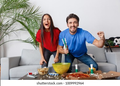 Young Couple Sport Fans Watching Match Cheering Team