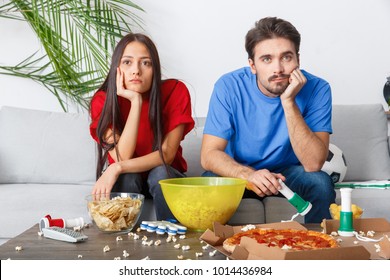 Young Couple Sport Fans Watching Match Boring Game