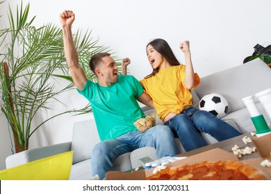 Young Couple Sport Fans Watching Match Teamwork