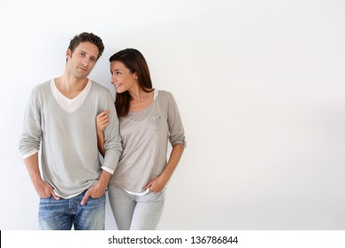 Young Couple Standing On White Background