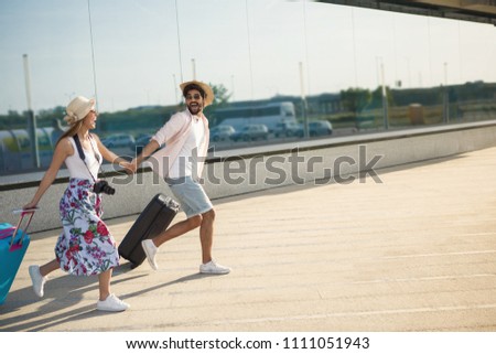 Young couple staring to arrive on a flight
