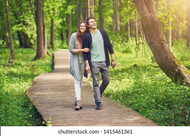 Young couple strolling in the park