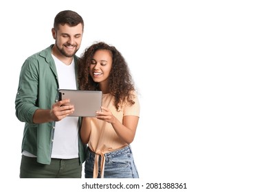 Young Couple With Tablet Computer On White Background