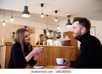 Young couple talking in a coffee shop. - Powered by Shutterstock