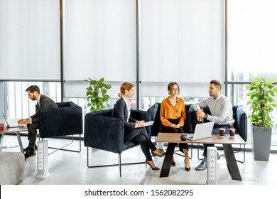 Young Couple Talking With Financial Consultant At The Luxury Bank Office. Investment Or Lending Concept For A Young Family