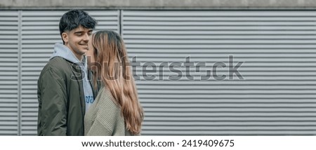 young couple talking on the street with copy space