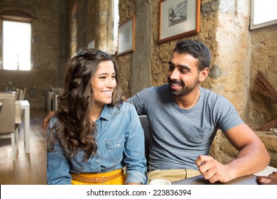 Young Couple Talking In Restaurant And Cafe