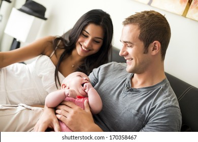 Young couple with their newborn baby - Powered by Shutterstock