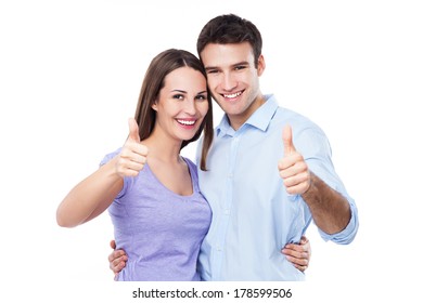 Young Couple With Thumbs Up 