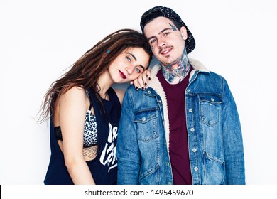 Young Couple Together. Guy With Tattoo, Girlfriend Wearing Dreadlocks Having Fun On White Background