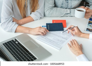 Young Couple In A Tour Agency Communication With A Travel Agent Travelling Concept Documents