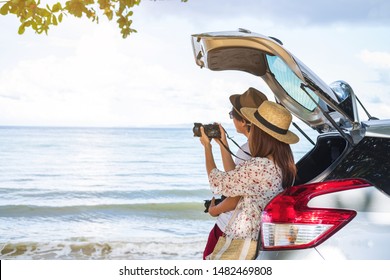 Young couple tourist looking at the beautiful beach and sea view with car while travel driving road trip on summer vacation - Powered by Shutterstock