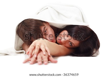 Similar – Image, Stock Photo Young couple in love embracing lying over a bed