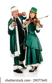Young couple in traditional St Patrick holiday outfit. Studio shot.