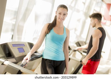 Young couple training in the gym