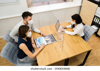 Young Couple With Travel Agent Wearing Face Mask