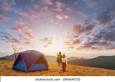 Young couple traveler looking landscape at sunset and camping on mountain, Adventure travel lifestyle concept - Powered by Shutterstock