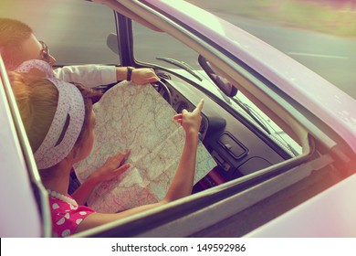 Young couple traveling by car on vacation