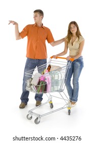 Young Couple With Trolley. Homosexual Boy Showing Something Bored Girl. Isilated On White In Studio. Whole Body, Front View