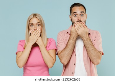 Young Couple Two Friends Family Man Woman In Casual Clothes Looking Camera Cover Mouth With Hand Together Isolated On Pastel Plain Light Blue Color Background Studio Portrait People Lifestyle Concept