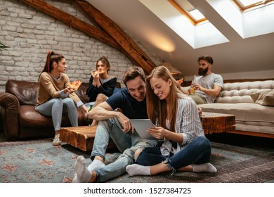 Young couple using a digital tablet together - Powered by Shutterstock
