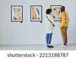 Young couple visiting art gallery