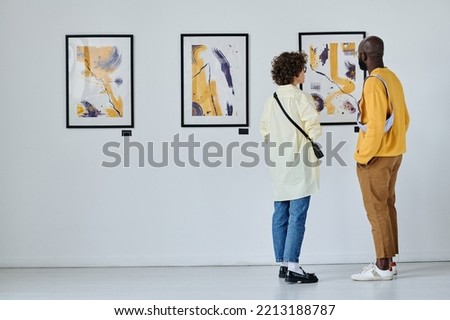 Young couple visiting art gallery