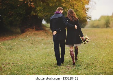 Young Couple Walking Away, Autumn Day