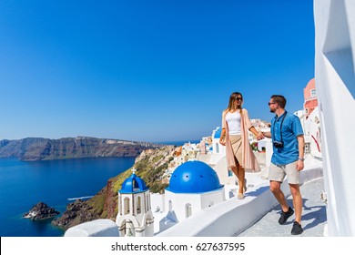 Young Couple Walking On The Island Of Santorini, Greece