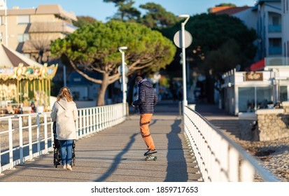 young couple walking on the pier - Powered by Shutterstock