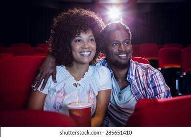 Young couple watching a film at the cinema - Powered by Shutterstock