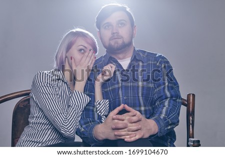 Similar – Young couple posing with funny faces