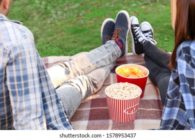 Young Couple Watching Movie In Outdoor Cinema