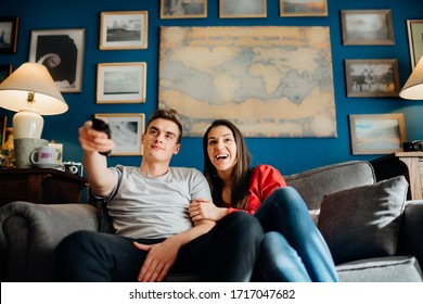 Young Couple Watching Television Together.Favorite Series New Episode.Excited About New Film.Couple Activities At Home During Quarantine Lockdown.Binge Watching Movies Marathon.TV Streaming Service