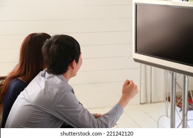 Young Couple Watching Tv