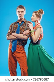 Young couple wearing colorful old-fashion clothes in pinup style