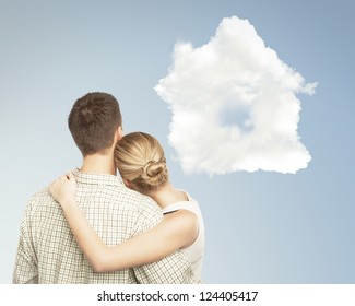 Young Couple And White Cloud House