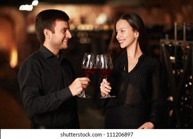 Young Couple In Wine Cellar